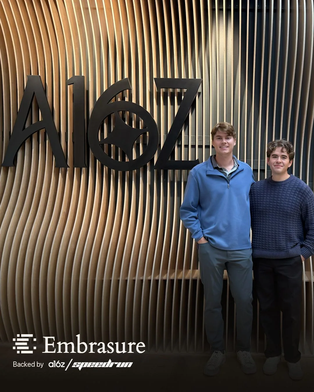 The Embrasure founders standing in front of the a16z mark.